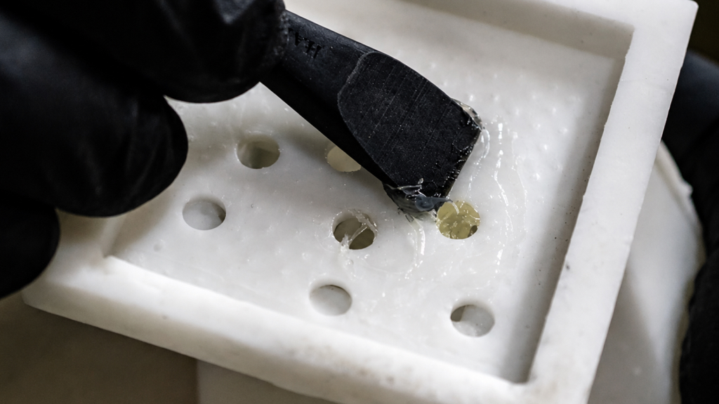 Applying HARZ Labs tough Gel with a spatula